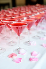 Table setting for party. Wineglasses with pink martini.