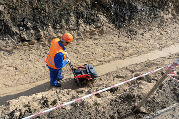 the worker is building a trench