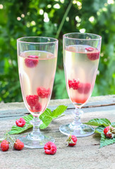 White wine with fresh raspberries. raspberry cocktail