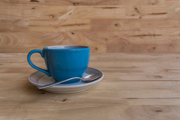 Coffee cup on the wood texture background