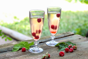 White wine with fresh raspberries. raspberry cocktail