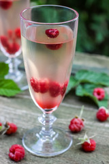 White wine with fresh raspberries. raspberry cocktail
