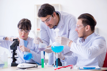 Team of chemists working in the lab
