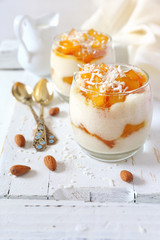 Two glass of homemade rice coconut milk cream  pudding with caramelized pineapple, dessert