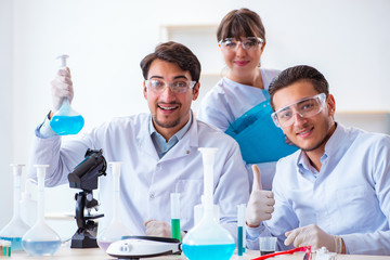 Team of chemists working in the lab