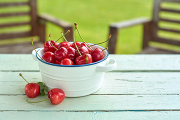 Dish of freshly harvested red sweet cherries