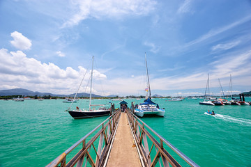 Fototapeta premium Travel by Thailand. Beautiful summer landscape with tropical sea marina lagoon and pier.