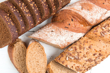 Fresh bread on wooden background.