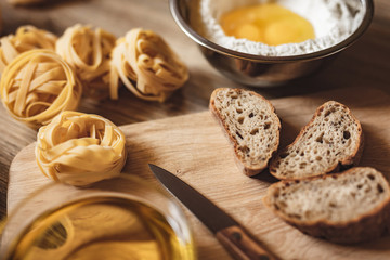 preparation recipe bread, pizza, spaghetti making ingridients, food flat lay on kitchen table...