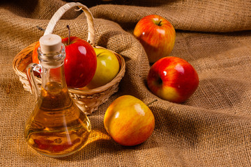 apple vinegar on a wooden rustic background