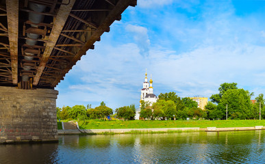 Naklejka premium View of the embankment and Epiphany Cathedral from under bridge in Oryol, Russia