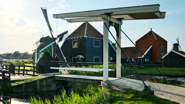 Bridge over canal at windmills at Zaanse Schans in Holland. Zaandam, Netherlands