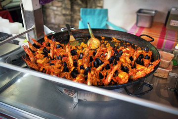 paella. street food. seafood dish: mussels and shrimp