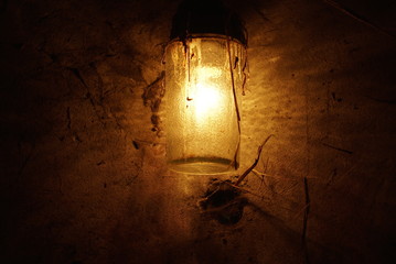 old dirty lamp glowing in the dark 