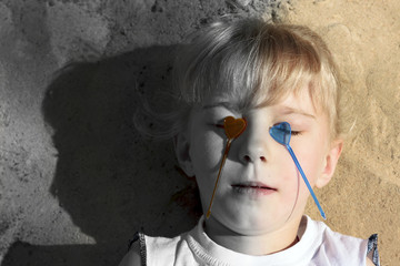 Little girl with hearts on eyes. The photo is divided into two halves with or without an inscription. No weapons