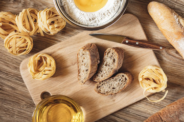 preparation recipe bread, pizza, spaghetti making ingridients, food flat lay on kitchen table...