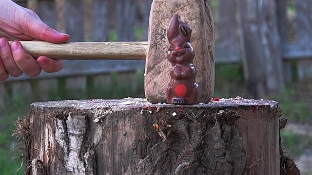 Food preparation crushed by a hammer giant, slow motion