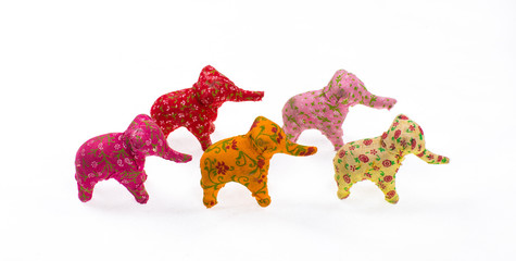 colored toy elephants on a white background