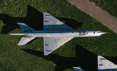 Aerial drone view on old jet fighters.