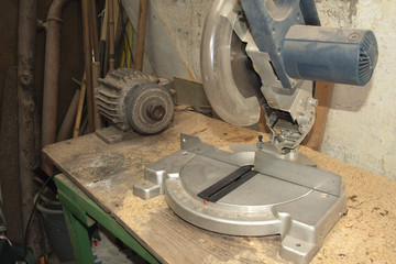 Electric saw on wood in the workshop, for cutting woodwork, close-up