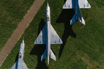 Aerial drone view on old jet fighters.