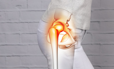 Woman suffering from hip joint pain - obrazy, fototapety, plakaty