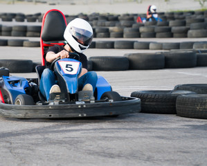 Kart crossing the finish line action, speed, helmet, track, driver, competition, motor, motion, adrenalin