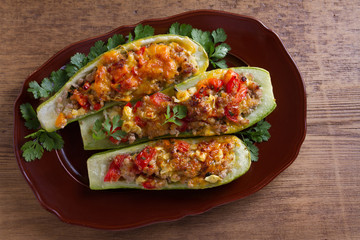 Zucchini stuffed with meat, vegetables and cheese. Zucchini boats. View from above, top studio shot