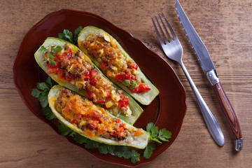 Zucchini stuffed with meat, vegetables and cheese. Zucchini boats. View from above, top studio shot