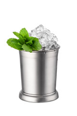 Silver mug with mint leaves and crushed ice