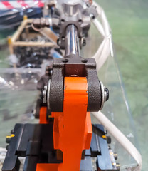 Close up. pivot joint of a cylinder, with metal bolts 
