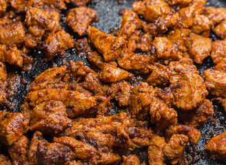 goulash pieces of meat are small fried until crusted before sauce and vegetables