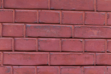 row of stones rectangle square painted light red paint with vertical and horizontal lines grunge background