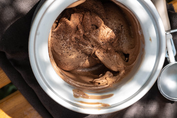 Bowl of chocolate ice cream on black  background.Top view