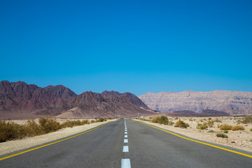Beautiful road in Israel desert. Sunny hot day