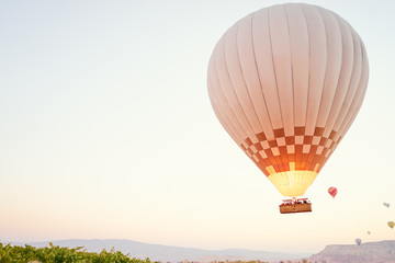 Fototapeta na wymiar Travel and tourism by Turkey. Famous sightseeing Cappadocia, Anatolia. Baloons in the sky.