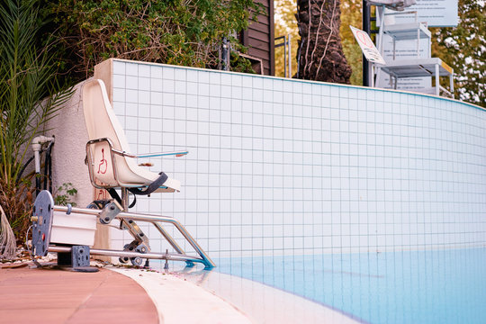 Disabled equipment chair in hotel swimming pool.