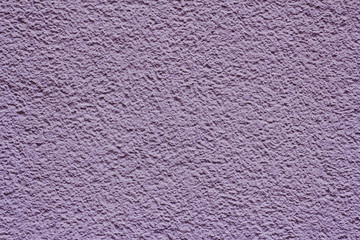 Violet textured plastered wall