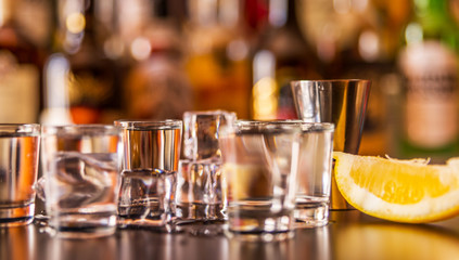 Traditional pure vodka in glasses on a black background, chilled drink