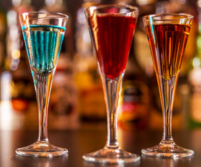 refreshing liqueur in a tall glass, alcoholic drink prepared by the bartender