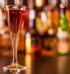 refreshing liqueur in a tall glass, alcoholic drink prepared by the bartender
