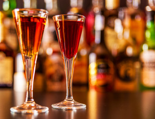 refreshing liqueur in a tall glass, alcoholic drink prepared by the bartender