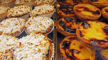 Traditional portuguese cakes - Almond cakes and cream cake "pasteis de nata" or "pasteis de Belem"    
