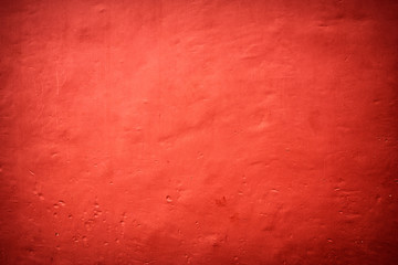 Textured backround. Red painted wall.