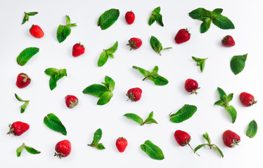 Pattern of leaves of fresh mint and strawberry. Top view. 