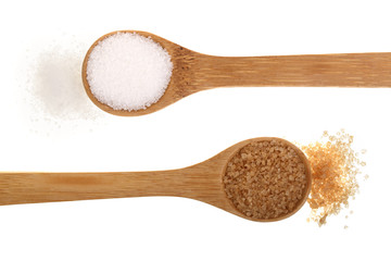 granulated brown and white sugar in wooden spoon isolated on white background. Top view. Flat lay