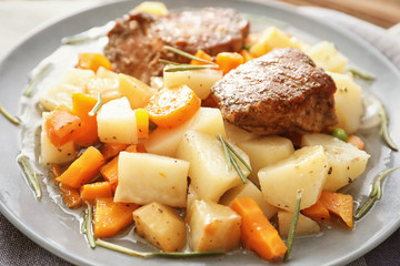 Plate with tasty meat and potatoes, close up