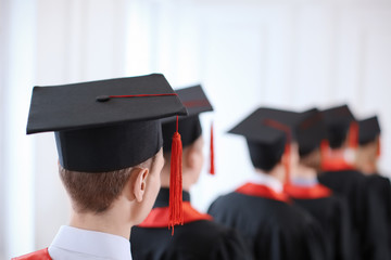 Student in mortarboard indoors. Graduation day