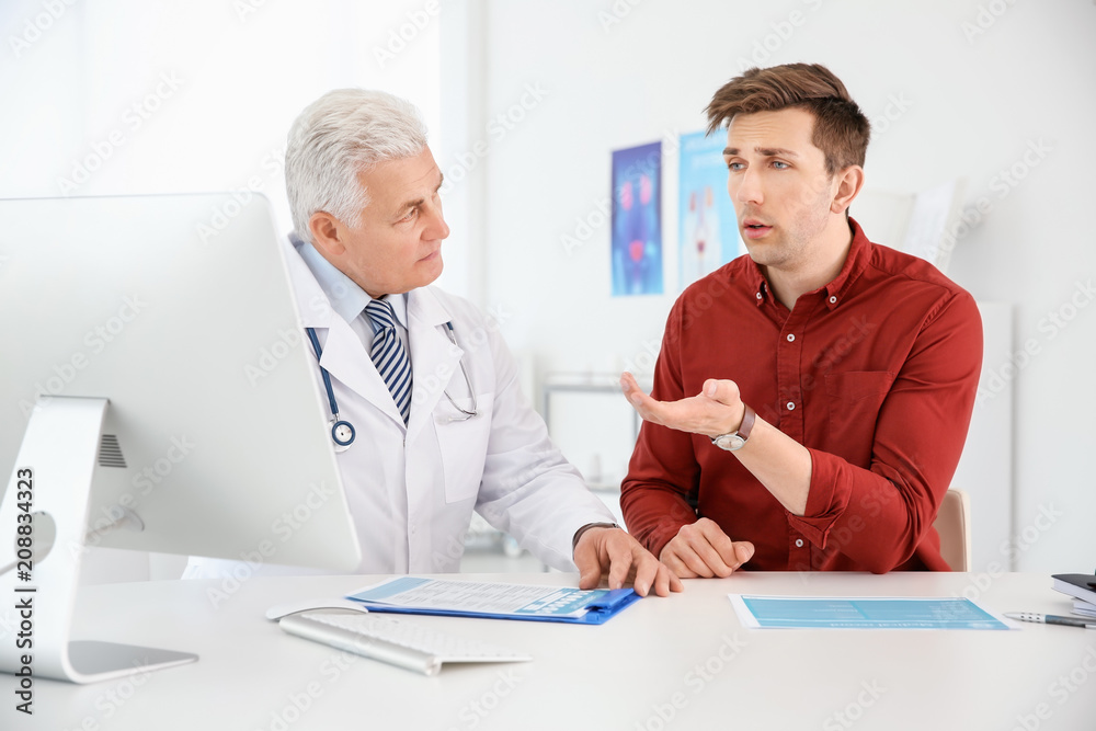 Canvas Prints Man with health problems visiting urologist at hospital