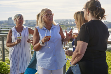 Senior Women Friends Enjoying Wine and Company